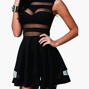 Black A-line dress with sheer panels. NEVER WORN